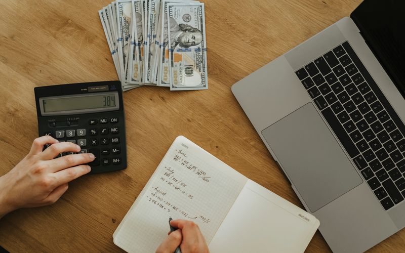 Budget laptop on a workspace desk with accessories — affordable laptops under UGX 2 million